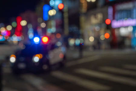 Police in an American city intervenes in a car accident. flashing highlightsの写真素材