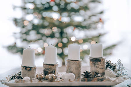 The four candles on the Advent wreath are lit every Sunday according to traditionの写真素材