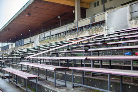 old stadium for a large number of spectators. Abandoned grandstands and buildingsの写真素材