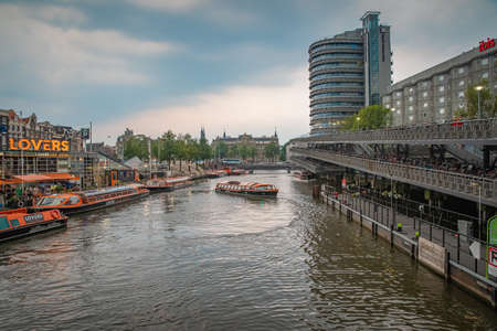 Amsterdam - August 27, 2019: transport on canals on a boat of the capital of the Netherlands