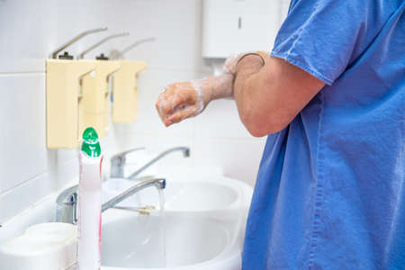 Washing hands with disinfectant soap as a precaution against disease and infection. The basic daily hygiene.の写真素材