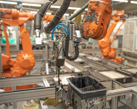 Automatic robotic arm in factory replaces human labor. Automation of production at the time of staff...
