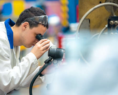 the engineer checks the correct setting of the metal mold for castings in the factory using a...