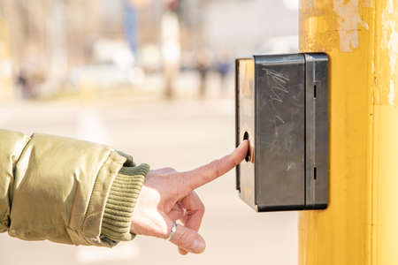 pedestrian button on a city street crossing