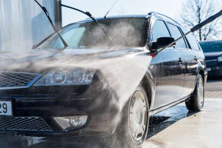 washing program at the self-service station. washing, rinsing and polishing of the car body under high pressure using treated water.の写真素材