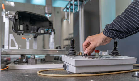 quality engineer controls an instrument for 3D measurement of plastic castings in the automotive industryの写真素材