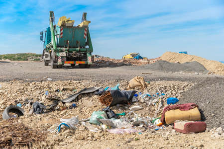 the garbage truck brought the waste to the landfill