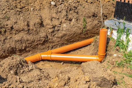 Plastic pipes in the ground for rainwater drainageの写真素材
