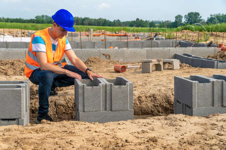 craftsman on the construction of the foundation of the building