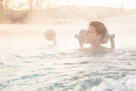 relax in the winter whirlpool in the wellness.の写真素材