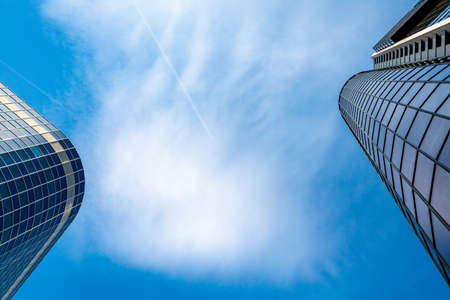 blue sky with modern skyscraper silhouettes