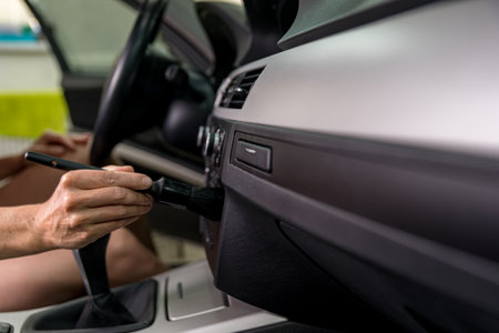 manual cleaning of the car interior with the help of brushingの写真素材