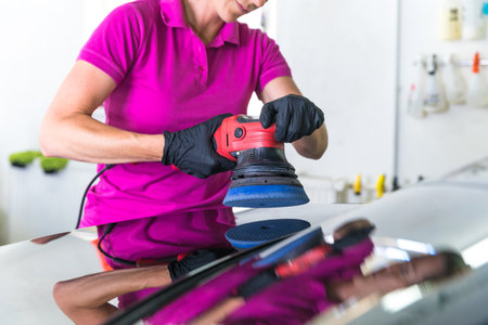 polishing the car body with a mechanical brushの写真素材