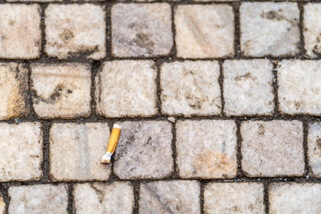 cigarette butt on the sidewalk in the cityの写真素材