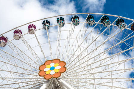 Ferris wheel in an amusement park.Blue skyの写真素材