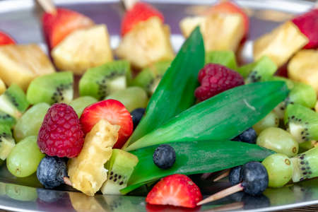 fruit skewers on a tray in celebration