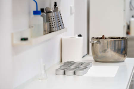 measuring cups for natural organic cosmetics in the factory