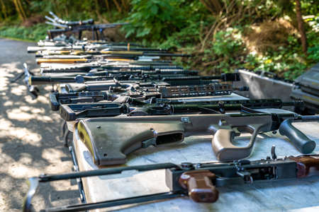 automatic weapons of various kinds on the table