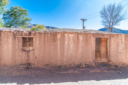 a house made of clay and red bricks in the countryside of Aregenina in the Andes mountainsの写真素材