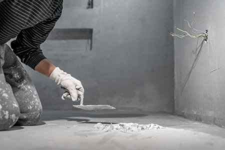 masonry work with a trowel on the construction siteの写真素材