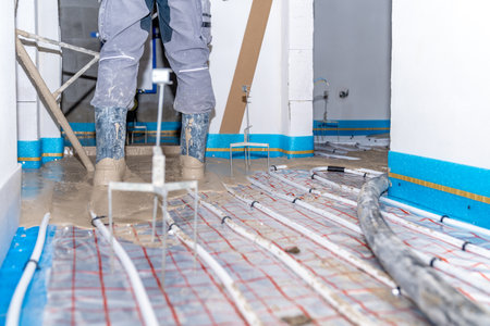 installation of liquid concrete on the floor for underfloor heatingの写真素材