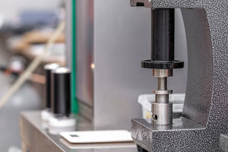 closed with the lid of beverage cans in an automatic capping machine in a breweryの写真素材