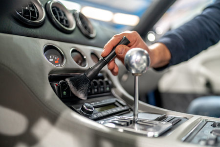 cleaning the interior of a luxury car with a brushの写真素材