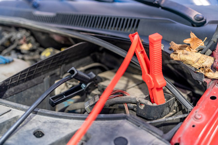 charging the car battery using electric cablesの写真素材