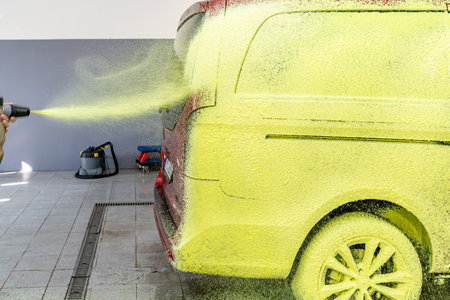 wash cars with green active foam in the garageの写真素材