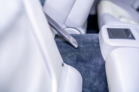 vacuuming the interior of luxury carsの写真素材