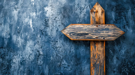 rustic wooden arrow sign mounted on a textured, mockup, blue-grey concrete wall, pointing to the right, evoking themes of direction, decision-making, and journey in an urban or industrial settingの素材