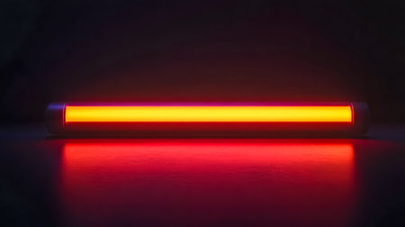 Modern led tube lamp illuminating dark space with orange lightの素材
