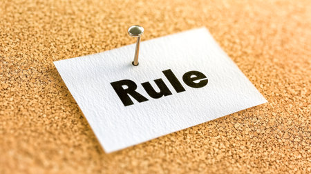 Push pin holding rule note on cork boardの素材