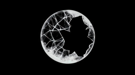 White glowing sphere breaking apart on black background, creating a visually striking contrast and suggesting concepts of fragility, destruction, or transformationの素材