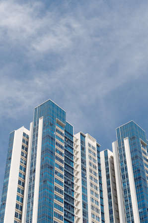 modern blue glass and white stone apartmentの写真素材