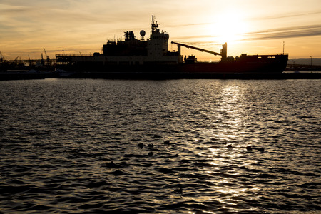 ST. PETERSBURG, RUSSIA - DECEMBER 07, 2017: Akademik Tryoshnikov, Russian scientific diesel-electric research vessel, the flagship of the Russian polar research fleet, at sunset time.のeditorial素材