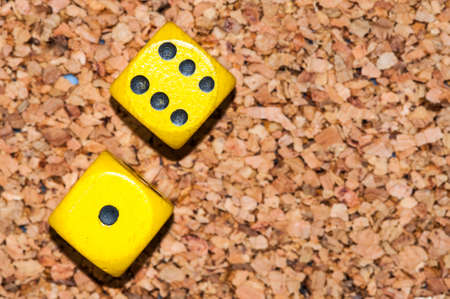 Yellow dices one six on cork