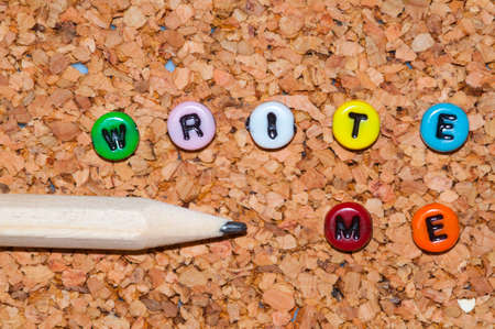 Colored write me with pencil on cork backgroundの写真素材