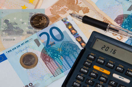 Money and calculator and pen in year 2016の写真素材