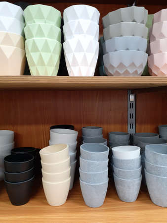 Plastic pots for plant care in a supermarket.