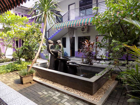 A small backyard pond. A pond provides an exciting addition to any garden, even a small one.のeditorial素材