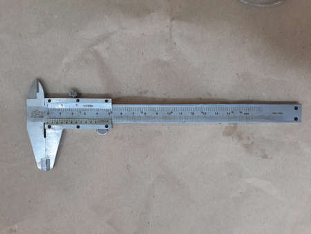Vernier Caliper on cardboard background.の写真素材