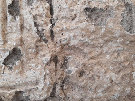 Perforated rough stone texture and background.の写真素材