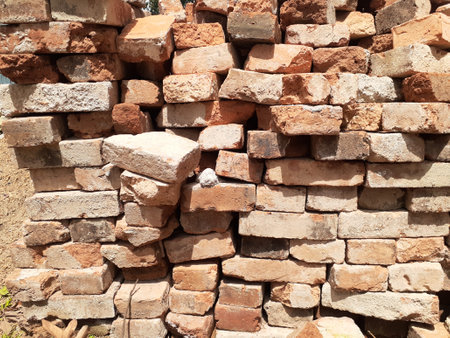 Red bricks pile with sunlight background.の写真素材