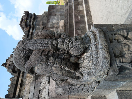 A photograph of an ancient stone carving at Sambisari Temple. Perfect for collections related to history, archaeology, Javanese culture, or classic Indonesian temple architecture.の写真素材