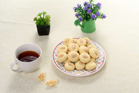 Graibe arabian biscuit with a cup of tea next to it