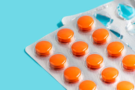 isolated tablet cartridges on a blue backgroundの写真素材