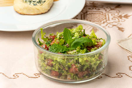 salad tabouleh in a clear glass container Arabic cookingの写真素材