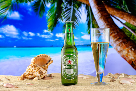 SÃ£o Paulo, Brazil - 09 , August, 2021 Heineken beer bottle on the beach sandのeditorial素材