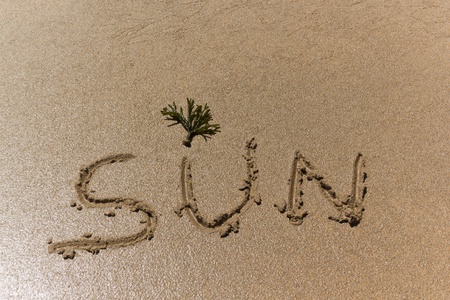 Writing in the sand on the beachの写真素材